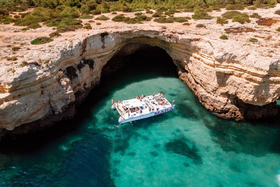 Albufeira: Caves and Coastline Catamaran Cruise to Benagil - Wi-Fi, Background Music, Champagne Toast, and Drinks for Purchase