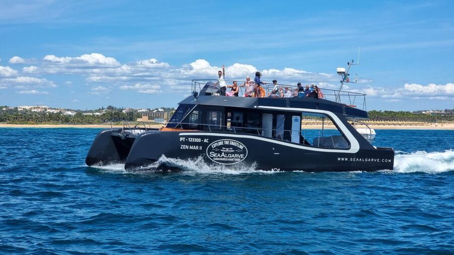 Albufeira: Coastline and Benagil Caves Tour by Catamaran - Guides, music, and the onboard vibe that keeps it fun