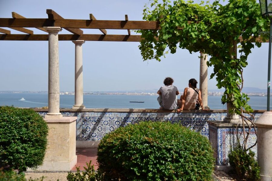 Best of Lisbon Walking Tour: Rossio, Chiado & Alfama - Alfama: tiled facades, wine and snack tastings, and the Fado vibe at street level
