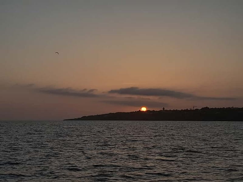 Cascais: Sunset Boat Trip with Welcome Drinks - Costa da Guia Cliffs, Open Sea Views, and the Sunset Moment
