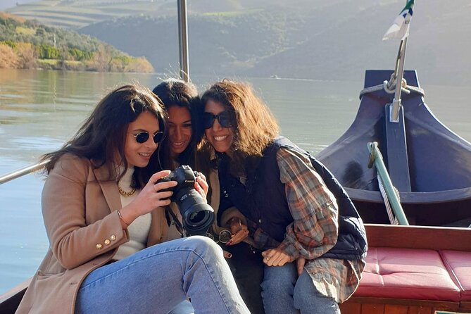 Douro Valley-Expert Guide-Boat-Lunch-Tastings-Offer wine bottle - Rabelo boat cruise on the Douro River near vineyards