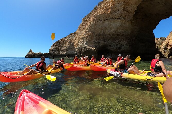 Explore Secret Caves and Beaches of Alvor - Boat & Kayak Tour - Board the wooden boat and glide through the Alvor estuary reserve