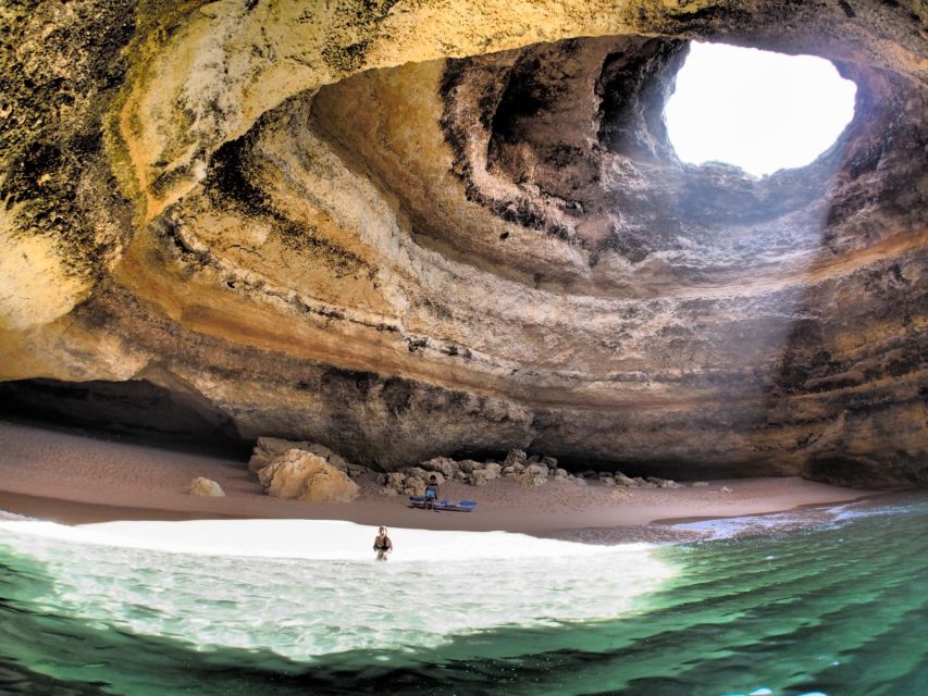 From Carvoeiro: Benagil Caves and Praia da Marinha Boat Trip - Praia da Marinha arches from the water, plus the lighthouse pass you do not want to miss