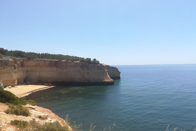 From Faro: Benagil Hiking Cliffs and the 4 Treasure Experience - Praia da Marinha: The Bridge, Heart, and Titanic Rock Stop