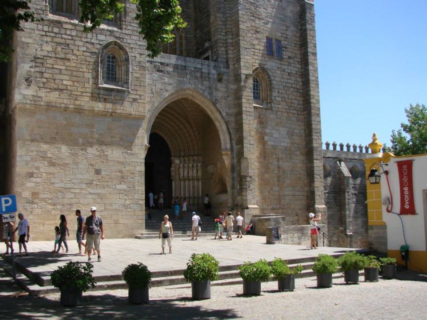 From Lisbon: Évora Wine & Heritage Tour - Entering Évora’s historic center with a guide who helps you read it
