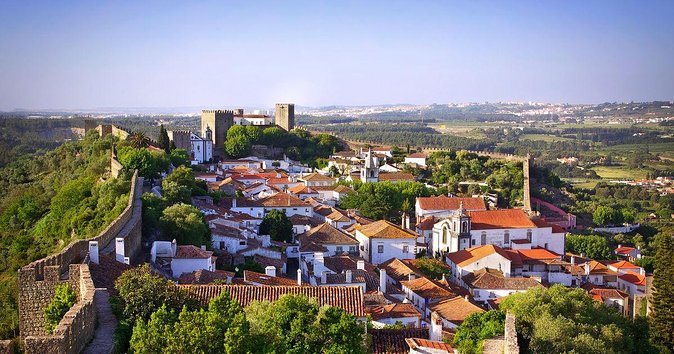From Lisbon: Fátima, Nazaré, Batalha, and Óbidos Guided Tour - The guides, the group pace, and that multilingual rhythm