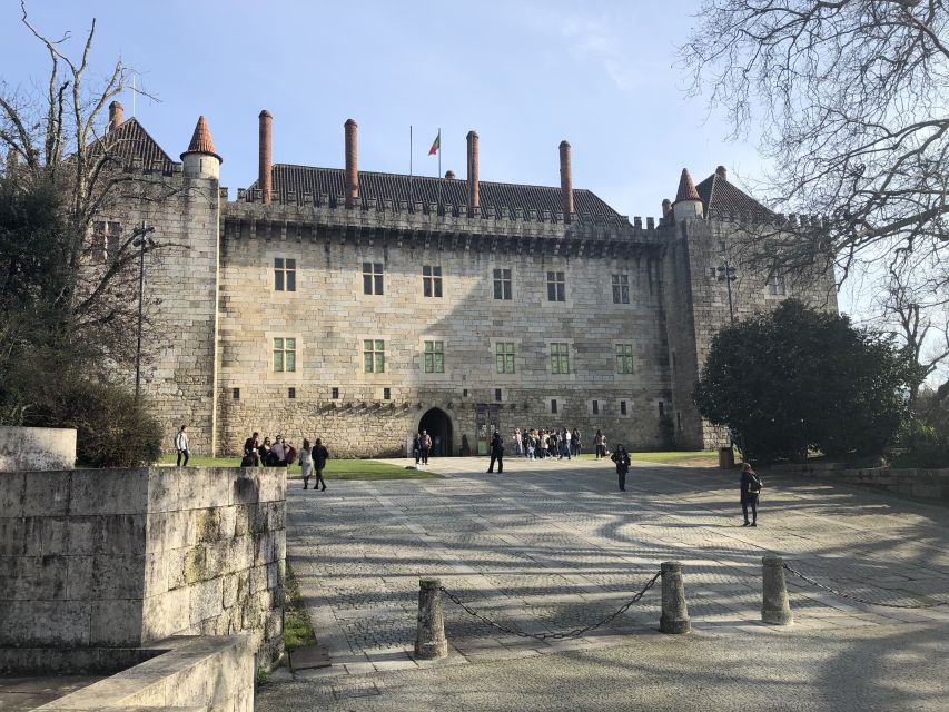 From Porto: Braga & Guimarães with Lunch Small Group Tour - Guimarães Castle, where you slow down and read the stones