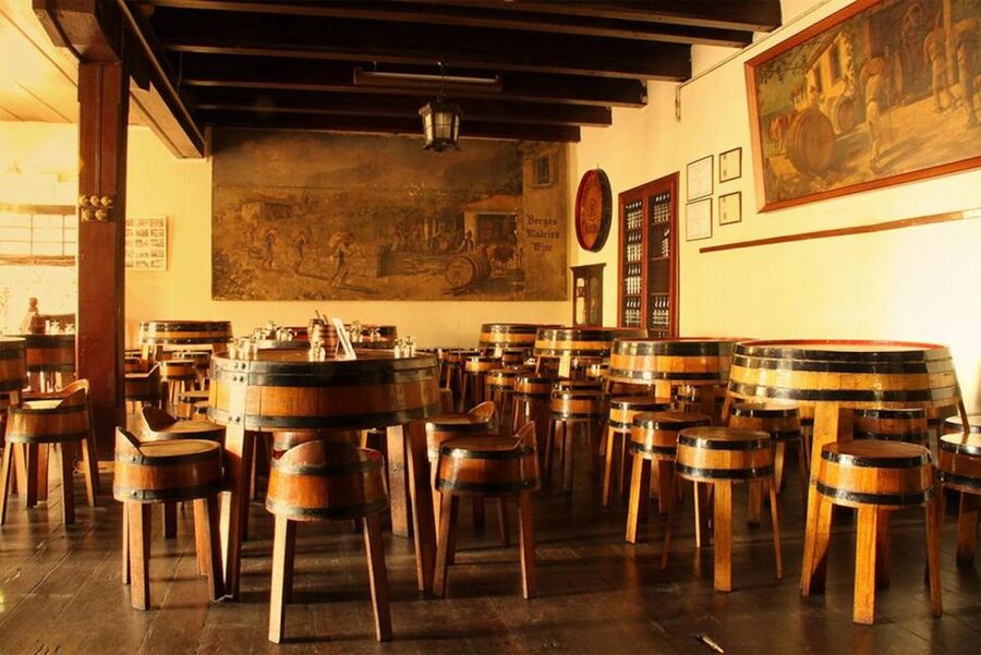 Funchal: H.M. Borges Winery Guided Tour with Wine Tasting - The tasting room with Max Römer art: where the samples come alive