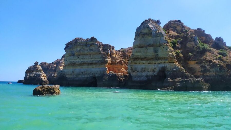 Lagos Grotto Trip in Different Languages - Why Ponta da Piedade Caves Look Better From a Boat