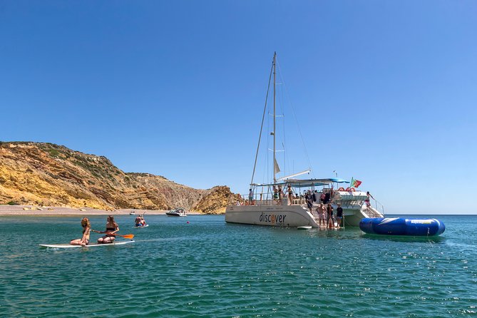 Lagos Half-Day Catamaran Cruise with Lunch - Swimming, paddleboards, and the inflatable open-water waterpark time
