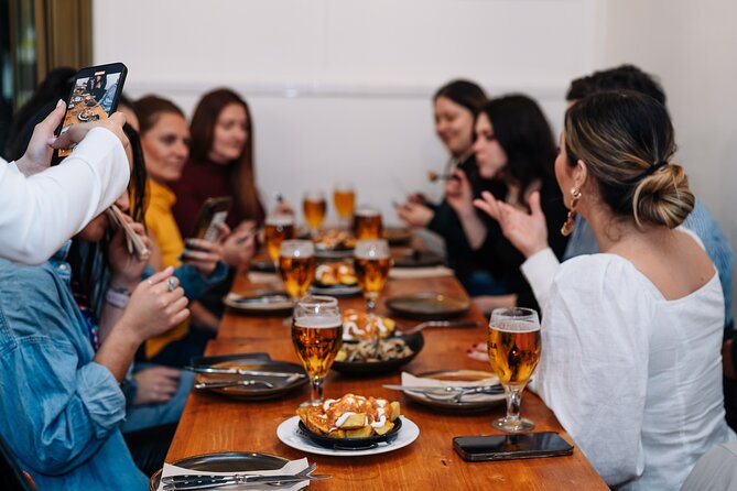 Lisbon: Award-Winning Guided Walking Food Tour with Local Drinks - Stops 2 and 3 in Baixa: petiscos, bacalhau à Brás, sardines, and vinho verde