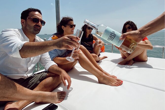 Lisbon: Catamaran Luxury Sunset and Wine Tour - The crew and skipper energy: what makes it feel guided