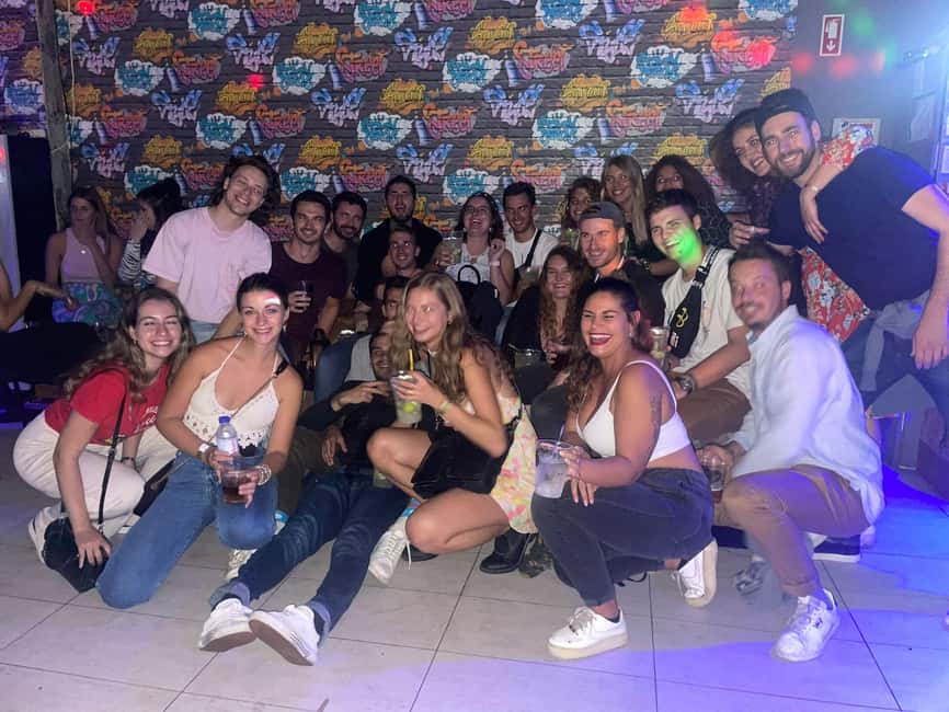 Lisbon: Pub Crawl with Open Bar (Premium Upgrade Available) - Second Bairro Alto Stop and Welcome Shots: Where the Group Gets Social