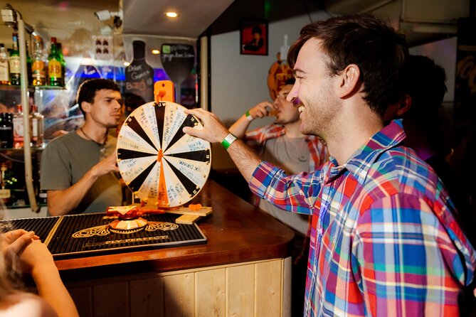 Lisbon: Pub Crawl with Open Bar, Shots & VIP Club Entry - Drinks deals, drinking games, and the extra shot finish