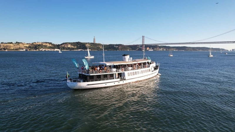Lisbon: Sunset Boat Tour with Music and Drinks - Entering the Rio Tejo at golden hour