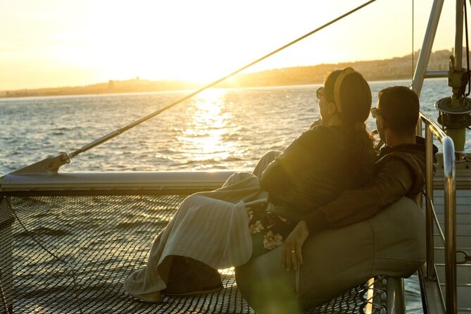 Lisbon: Sunset Catamaran Boat Tour with Music and Drinks - What to pack for an after-sunset breeze, even in warm months