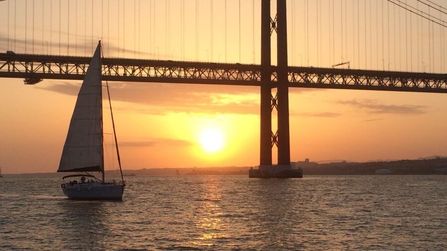Lisbon: Sunset Cruise with Drinks - The 25 de Abril Bridge is the big visual payoff