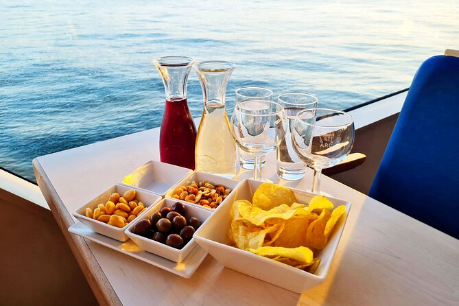 Lisbon Sunset cruise with Welcome Drink and Snack included - The boat experience: silent ride, panoramic windows, and AC comfort
