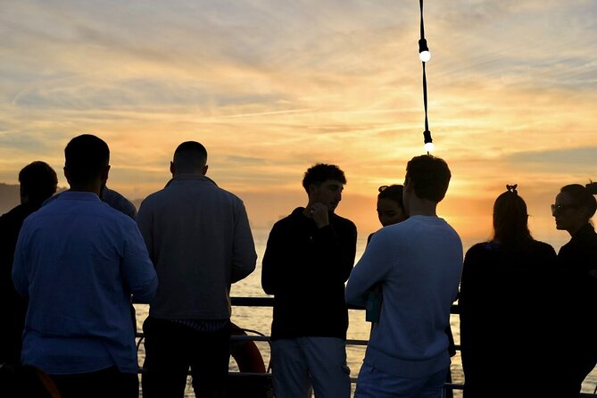 Lisbon: Sunset on board with music & drinks - Cristo Rei and the 25 de Abril Bridge: the dramatic mid-cruise moments