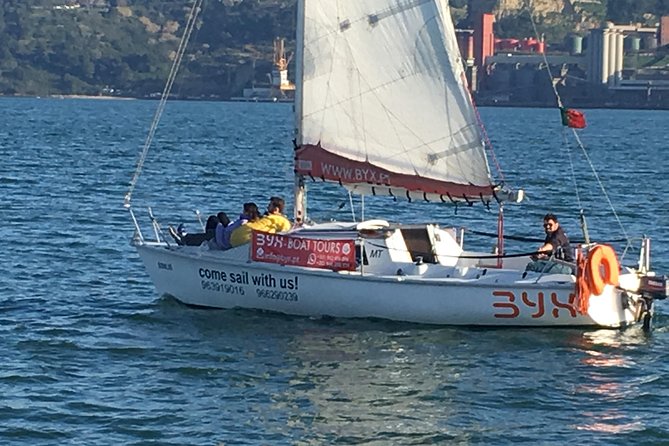 Lisbon Sunset Sailing Tour with White or Rosé Wine and Snacks - Wine, snacks, and the small-boat reality check
