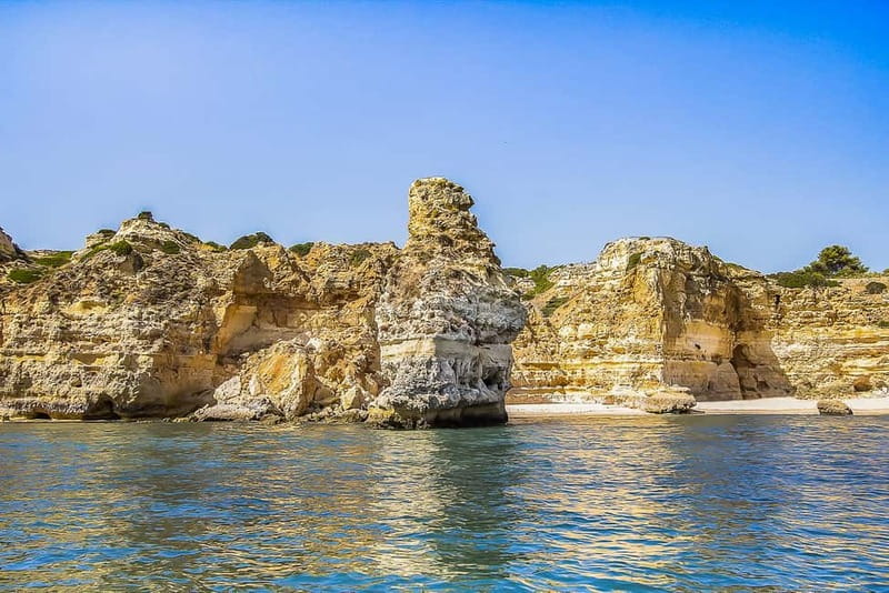Limestone stacks and sea caves on the Algarve coast, seen from the water