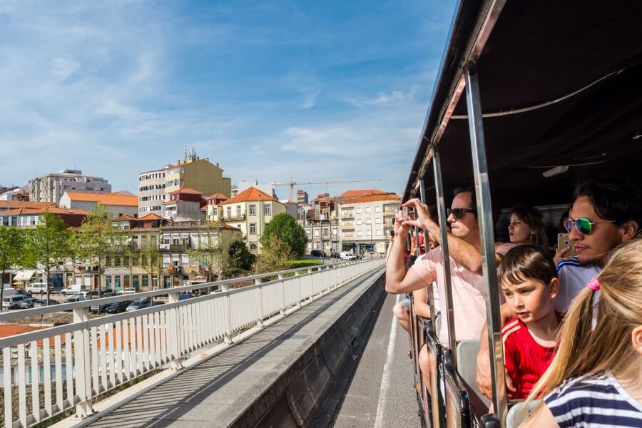 Porto: City Train Tour, River Cruise & Wine Cellar - Real Companhia Velha cellar visit, film, barrels, and two port tastings