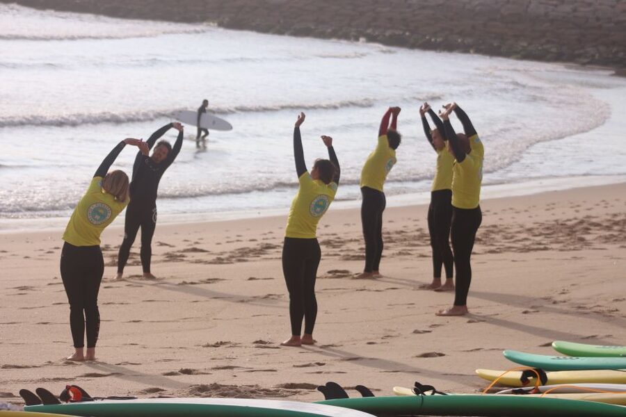 Porto: Small Group Surf Lesson with Transportation - Paddling out and the moment the wave does something
