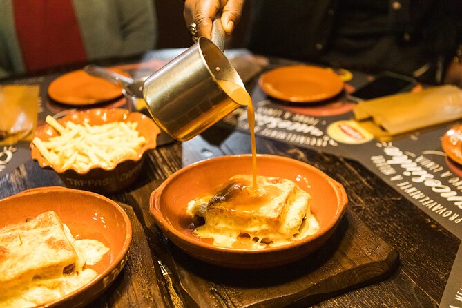 Porto Wine & Dine: Port Wine Cave Food Tour with Eating Europe - Alheira on Rua Luís de Camões, and bacalhau on Rua Cândido dos Reis