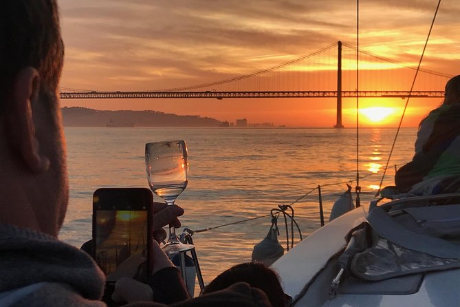 Sail & Dine Sailboat Tour With Sunset - Comfort tips for cooler Lisbon nights on the water