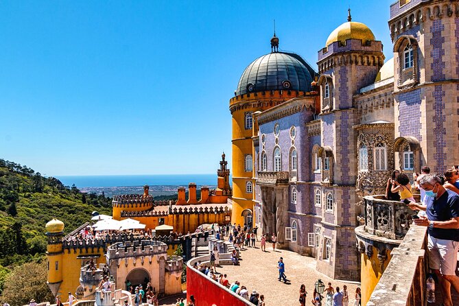 Sintra, Pena Palace, Quinta da Regaleira & Cascais Group Tour - Pena National Palace and Park: fairytale colors, terraces, and crowd management